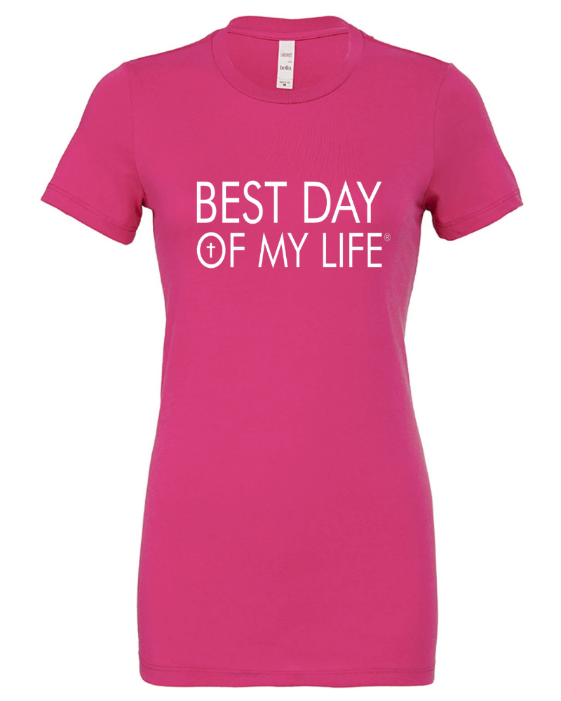 bright pink fitted crewneck t-shirt with best day of my life written across in white with a cross in the O